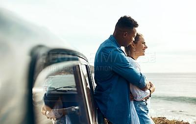 Buy stock photo Shot of a happy young couple looking at the view on a road trip along the coast