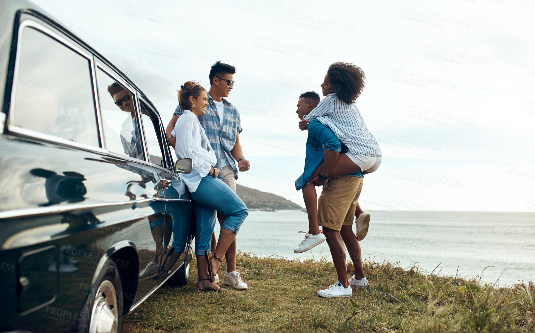 Buy stock photo Conversation, piggyback and road trip with people on coast together for getaway, holiday or vacation. Bonding, car and travel with couple of happy friends outdoor on shore for adventure in summer