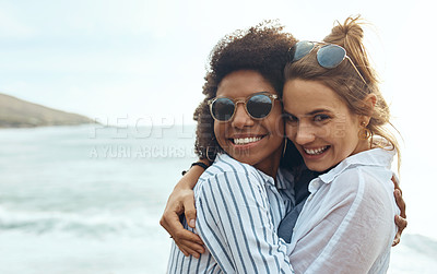 Buy stock photo Shot of two happy young friends enjoying a vacation along the coast