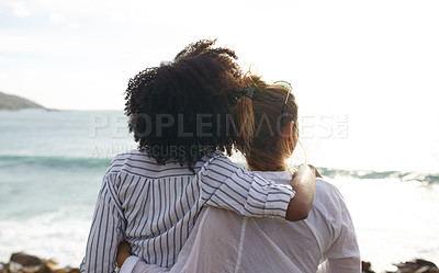 Buy stock photo Rearview shot of happy young friends looking at the view on a vacation along the coast