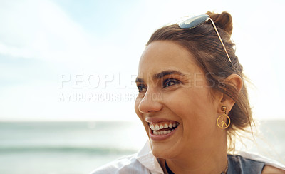 Buy stock photo Shot of an attractive young woman enjoying a vacation along the coast