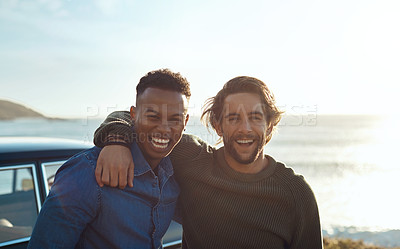 Buy stock photo Shot of two happy young friends enjoying a vacation along the coast