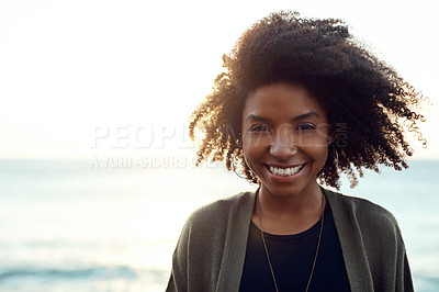 Buy stock photo Shot of an attractive young woman enjoying a vacation along the coast