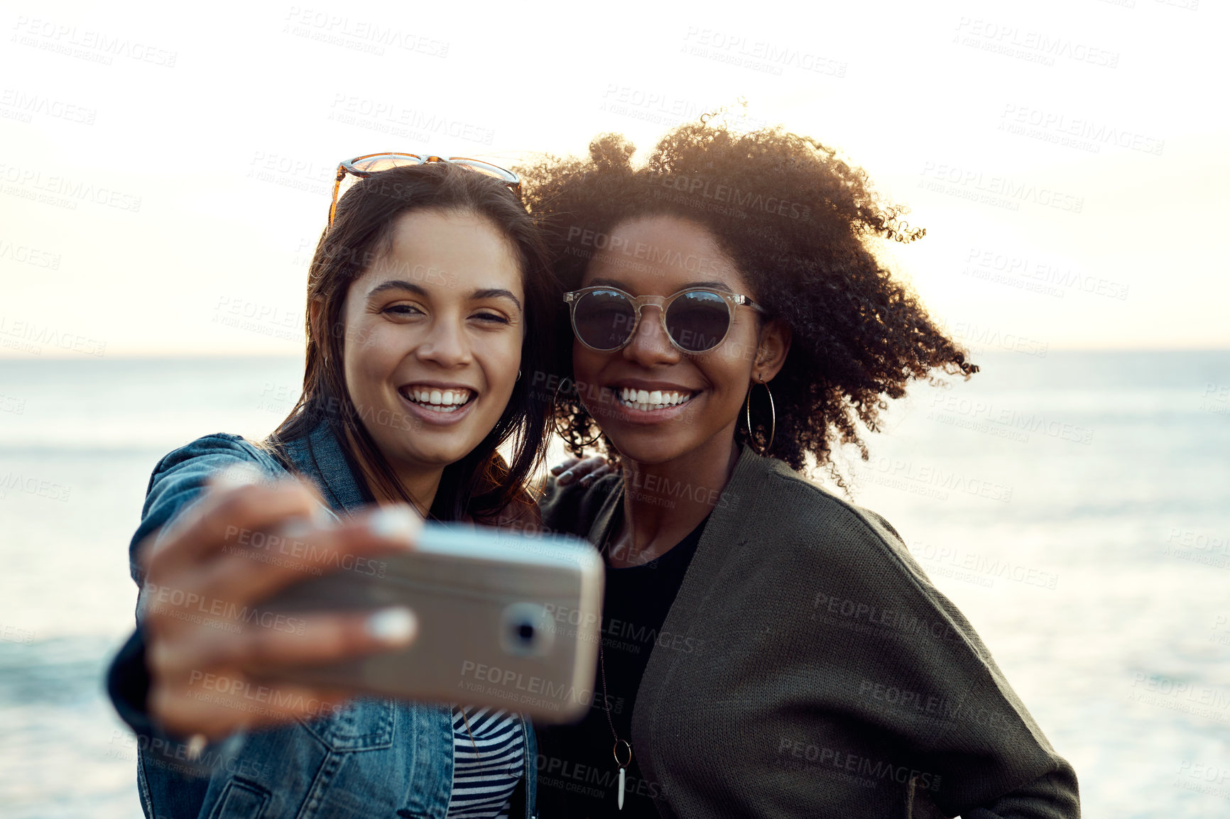 Buy stock photo Selfie, friends and women at beach with smile for bonding, get together or travel with memory. Happy people, picture and photography by ocean with adventure, girls trip or capture seaside reunion