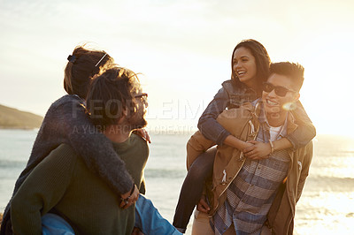 Buy stock photo Shot of a group of happy young friends having fun on a vacation along the coast