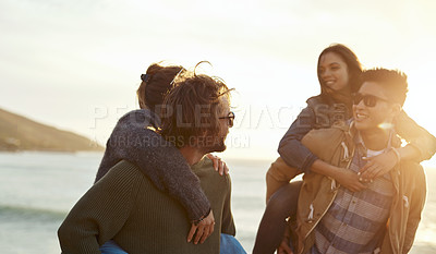 Buy stock photo Shot of a group of happy young friends having fun on a vacation along the coast