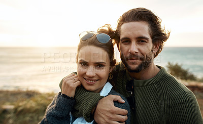 Buy stock photo hot of a happy young couple sharing a romantic moment on a vacation along the coast