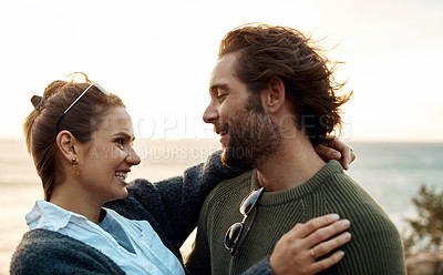Buy stock photo hot of a happy young couple sharing a romantic moment on a vacation along the coast