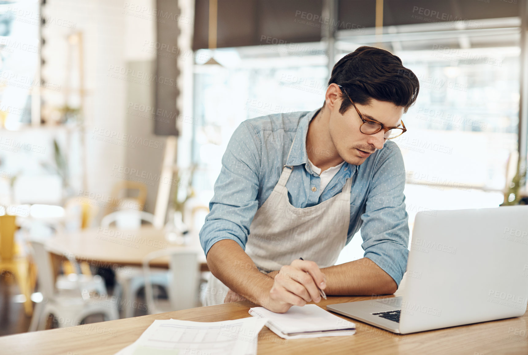 Buy stock photo Laptop, waitress and documents with man in cafe for delivery review, menu budget and planning. Small business, paperwork and restaurant funds with person in coffee shop for invoice and stock