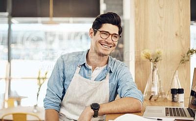 Buy stock photo Cropped shot of a cafe owner sitting in his shop