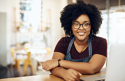 Buy stock photo Cropped shot of a young coffee shop owner sitting in her shop