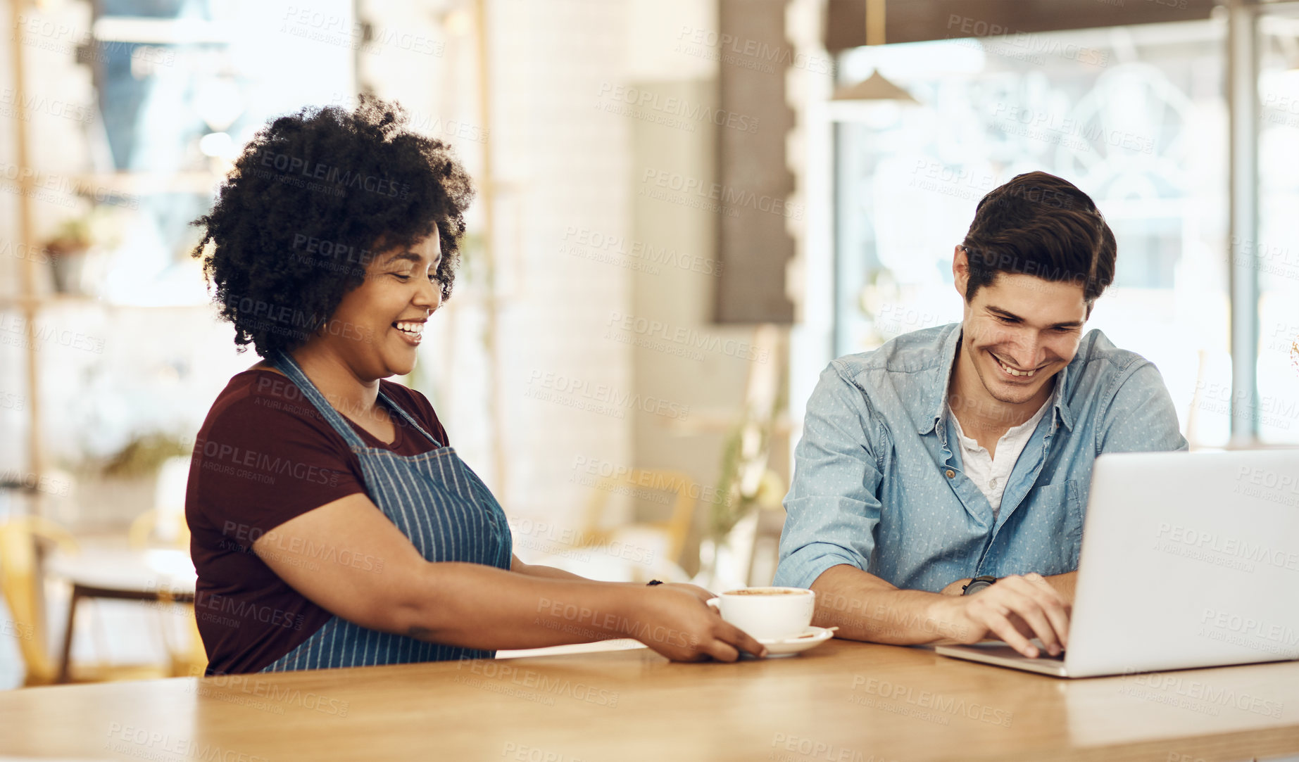 Buy stock photo Shot of a young woman serving a customer in a cafe