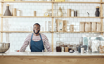 Buy stock photo Cropped shot of a young shop owner standing in his cafe