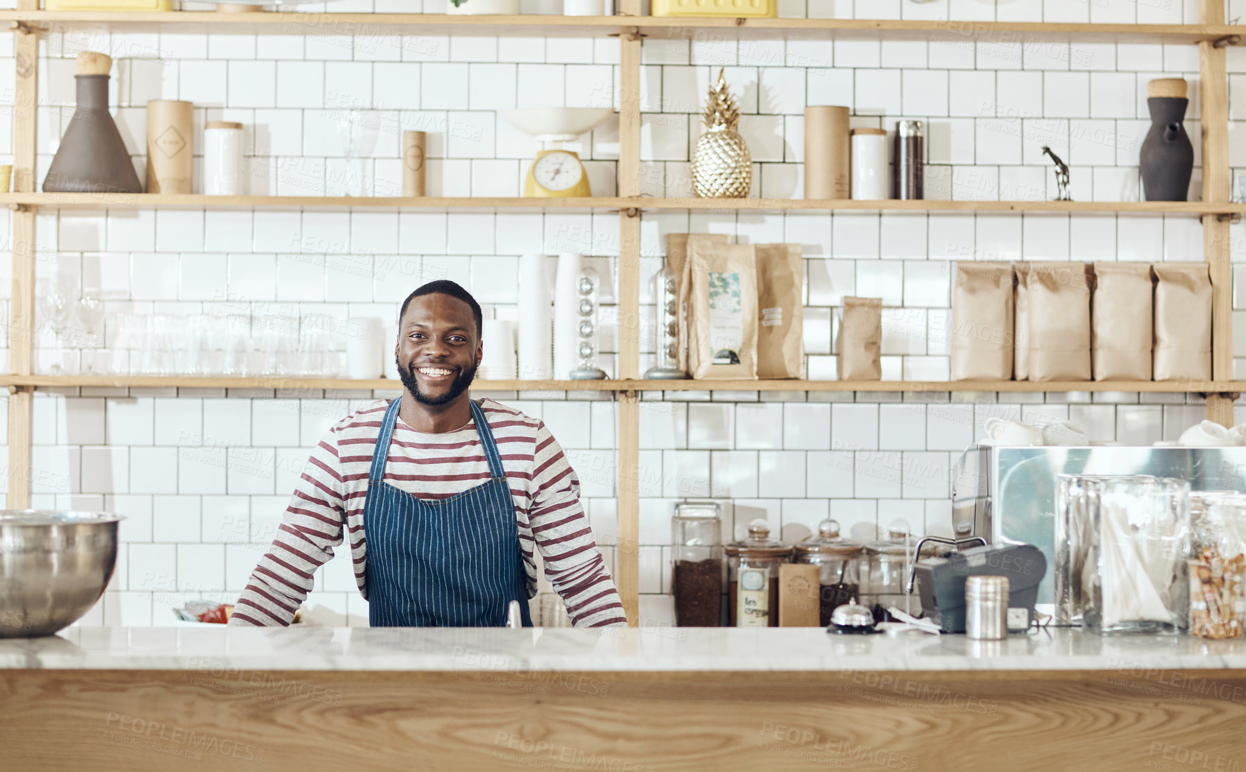 Buy stock photo Cropped shot of a young shop owner standing in his cafe