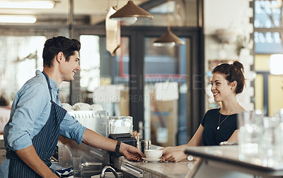 Buy stock photo Shot of a young man serving a customer in a cafe