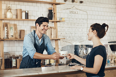 Buy stock photo Shot of a young man serving a customer in a cafe