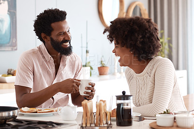 Buy stock photo Cropped shot of a couple having breakfast in their kitchen