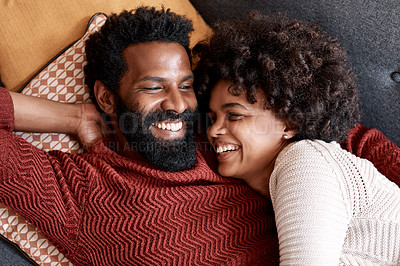 Buy stock photo Cropped shot of an affectionate couple relaxing on the sofa at home