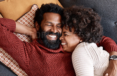 Buy stock photo Cropped shot of an affectionate couple relaxing on the sofa at home