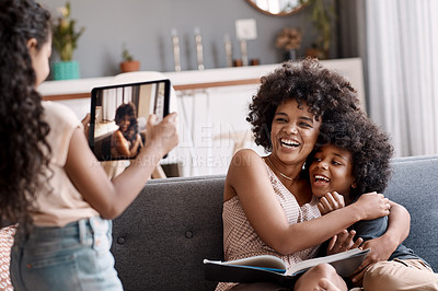 Buy stock photo Shot of a happy mother bonding and spending time with her two adorable young children at home