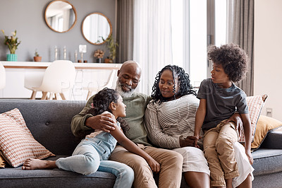 Buy stock photo Shot of two adorable young siblings bonding and spending time with their grandparents at home