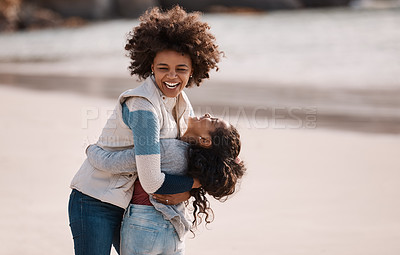 Buy stock photo Shot of an adorable little girl having a fun day at the beach with her mother