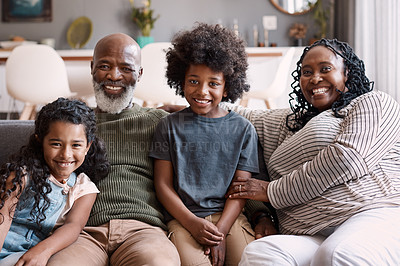 Buy stock photo Portrait of two adorable young siblings bonding and spending time with their grandparents at home