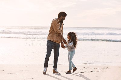 Buy stock photo Shot of an adorable little girl having a fun day at the beach with her father