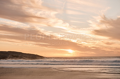 Buy stock photo Shot of a beautiful sunset at the beach