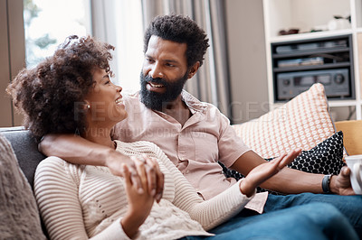 Buy stock photo Cropped shot of an affectionate couple relaxing on the sofa at home