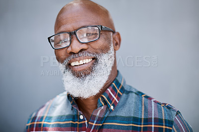 Buy stock photo Portrait of a mature man standing against a grey background