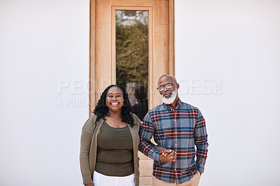 Buy stock photo Portrait of a mature couple standing outside their home