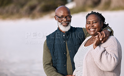 Buy stock photo Shot of a happy mature couple spending a romantic day at the beach