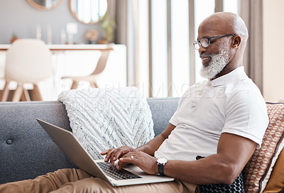 Buy stock photo Shot of a mature man using a laptop at home