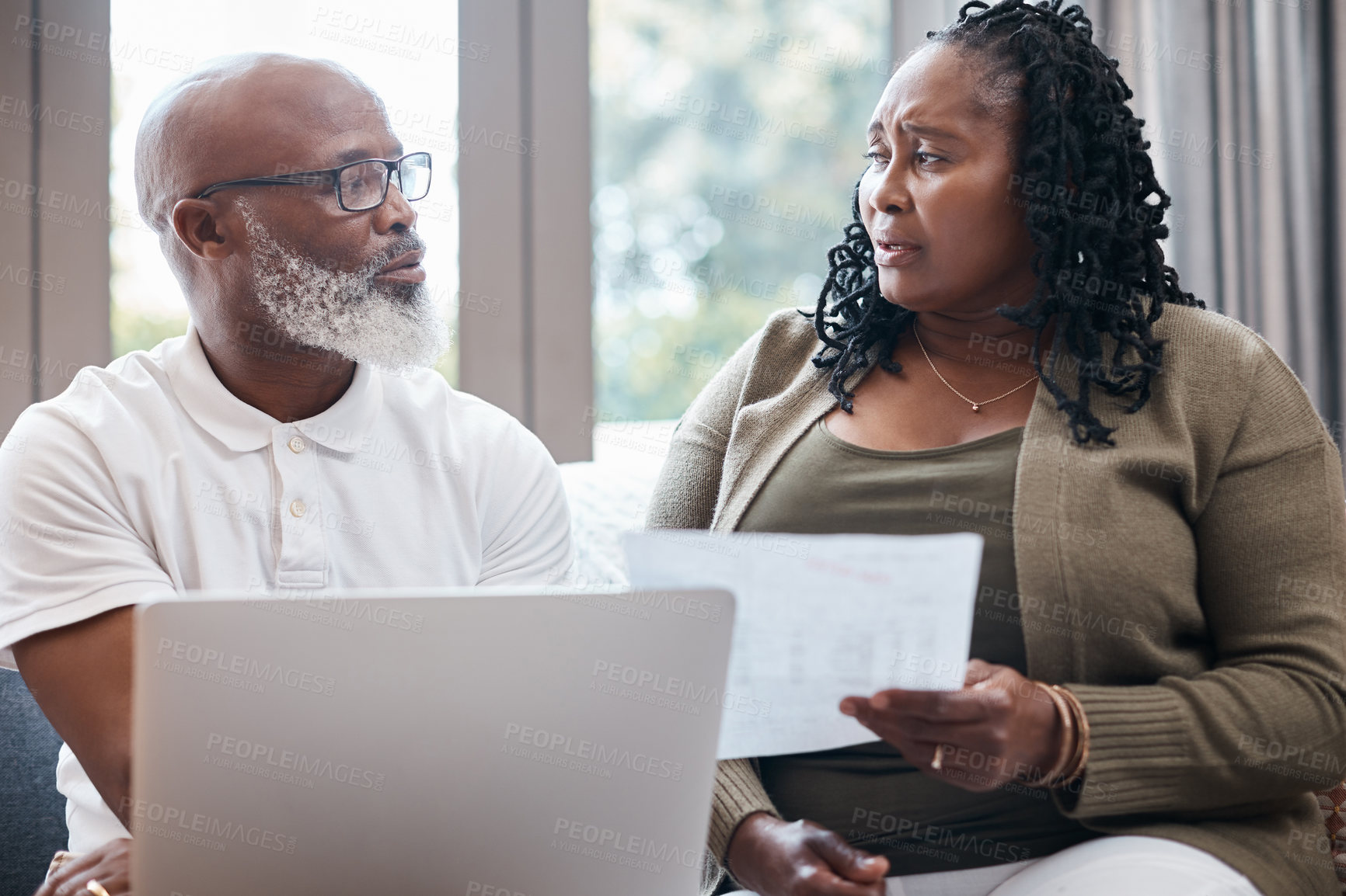 Buy stock photo Mature, debt and black couple with document in home for financial crisis, loss or eviction notice. Man, woman or computer with finance or expenses for bad news, bankruptcy or final warning in house