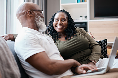 Buy stock photo Shot of a mature couple using a laptop together at home