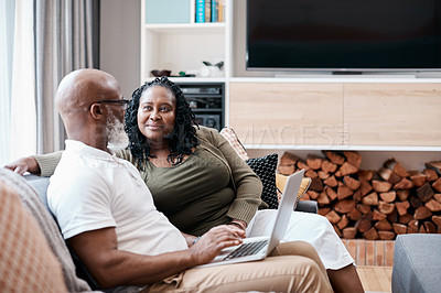 Buy stock photo Shot of a mature couple using a laptop together at home