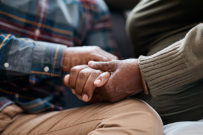 Buy stock photo Closeup shot of a mature couple holding hands at home