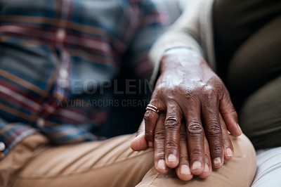 Buy stock photo Closeup shot of a mature couple holding hands at home