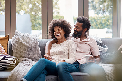 Buy stock photo Cropped shot of an affectionate couple relaxing on the sofa at home