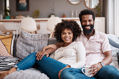 Buy stock photo Cropped shot of an affectionate couple relaxing on the sofa at home