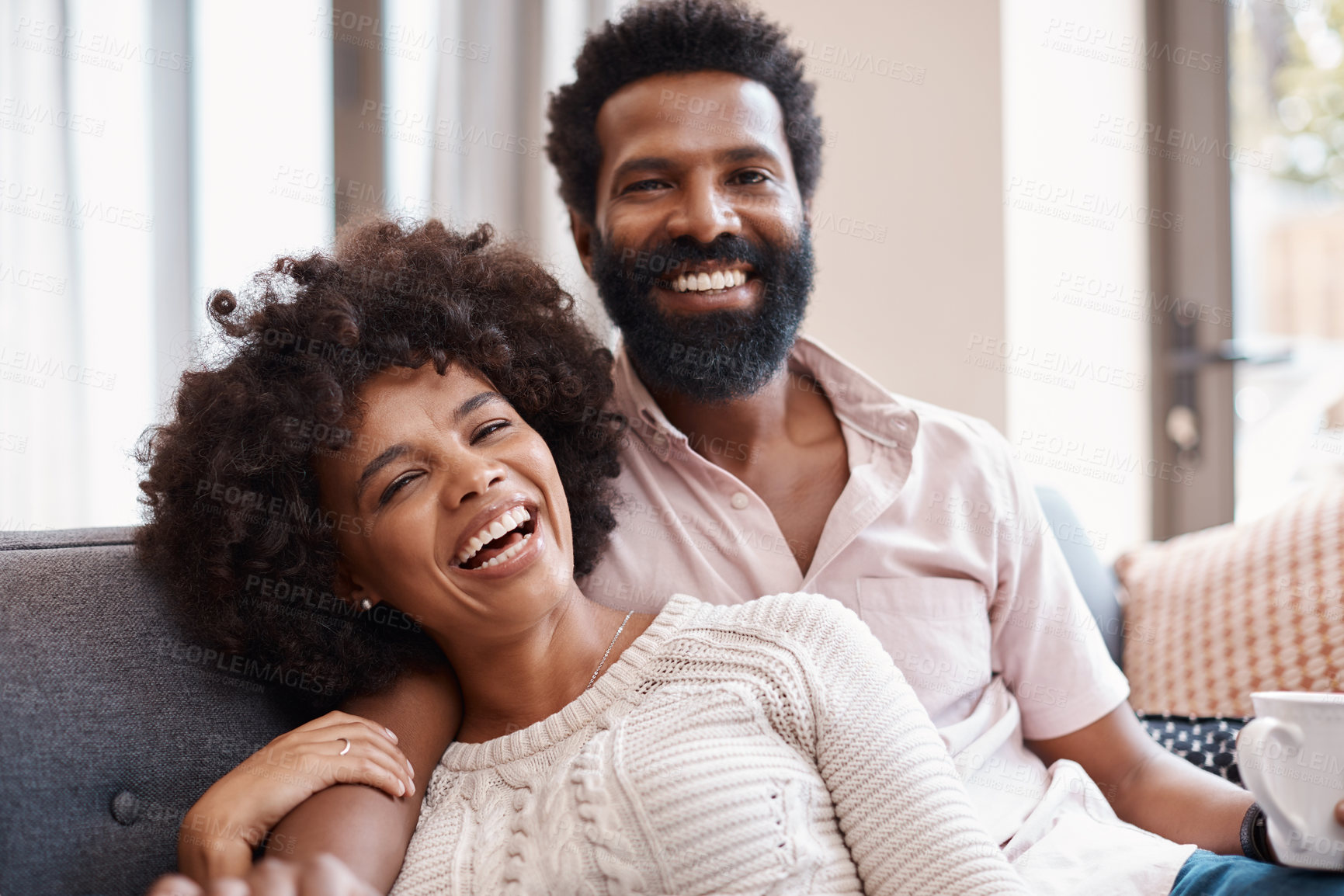 Buy stock photo Relax, portrait and couple in home with coffee, connection and bonding together on weekend break. Chill, partner and African people with warm drink, happy moment and day off in romantic relationship.