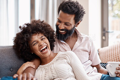 Buy stock photo Cropped shot of an affectionate couple relaxing on the sofa at home