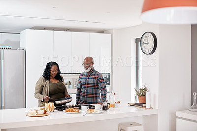 Buy stock photo Shot of a mature couple cooking together at home