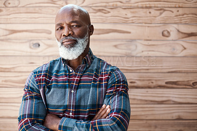 Buy stock photo Portrait of a mature man standing against a brown background