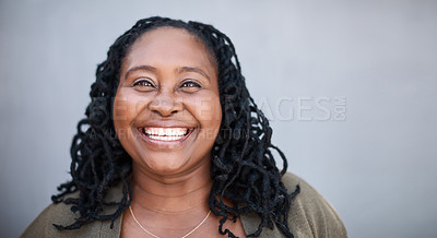 Buy stock photo Portrait of a mature woman standing against a grey background