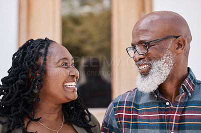 Buy stock photo Shot of a mature couple standing outside their home