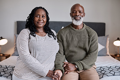 Buy stock photo Portrait of a mature couple sitting together in their bedroom at home