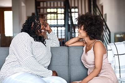 Buy stock photo Shot of a happy young woman bonding and spending time with her mother at home