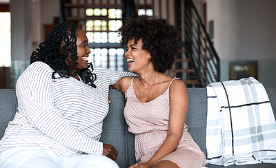 Buy stock photo Shot of a happy young woman bonding and spending time with her mother at home